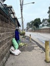 Streets of Nairobi with a man selling roasted maize in Kenya