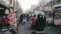 The streets are in a narrow alley full of snacks in the old tangerang market