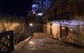 The streets of night Valletta. Walk the stairs in the dark.