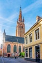 Streets of old Bruges with Church of Our Lady tower, Belgium Royalty Free Stock Photo