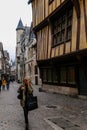 On the streets of the old town of Rouen with traditional half-timbered heritage houses. Rouen, Normandy, France