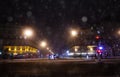 Streets of Paris during snowfall at winter night Royalty Free Stock Photo