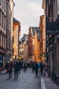 Streets with people in the old part of the city with houses from hundreds of years back