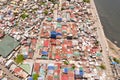 Streets of poor areas in Manila. The roofs of houses and the life of people in the big city. Poor districts of Manila, view from Royalty Free Stock Photo