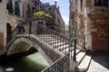 Streets of post Covid Venice with a bridge over beautiful water canal.