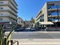 The streets of Rethymno in Crete, Greece on a sunny morning with parked cars around buildings