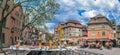 Streets with traditional medieval Alsatian buildings, shops and tourists. Colmar, France