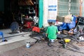 On the streets of Vietnam. Scene welder working.