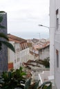 Streets with white houses and orange tiled roofs, an ancient portuguese city on the ocean