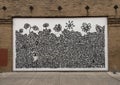 Streetside black and white mural by Ben Reynolds in Deep Ellum in East Dallas, Texas.