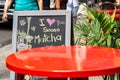 Streetside Cafe table in New York City with chalkboard Royalty Free Stock Photo
