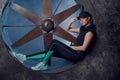 Streetstyle, fashion. Young girl posing on propellers background Royalty Free Stock Photo