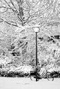 Streetview in snow with lamp-post and bike Royalty Free Stock Photo
