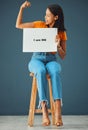 Strength, poster and black woman with strong arm pose in studio for body positivity, acceptance or self love on grey Royalty Free Stock Photo