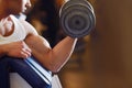 Strength is true sexiness. a handsome young man lifting weights. Royalty Free Stock Photo