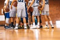 Strength in Unity: Basketball Team Huddling Together for Victory. Youth Players in Basketball Team Gathering During Break Time