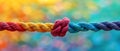 The Strength and Unity of a Diverse Team: Ropes Symbolizing Diversity against a Colorful Royalty Free Stock Photo