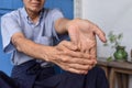 Strengthening exercise for arm muscles of Asian elder patient with muscle spasm Royalty Free Stock Photo