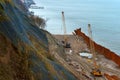 Construction of the promenade at sea, strengthening the sea coastline, special equipment on the beach Royalty Free Stock Photo