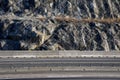 Strengthening the slope with a steel net anchored deep into the rock. falling rocks do not fall on the road. Double barriers are o Royalty Free Stock Photo