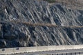 Strengthening the slope with a steel net anchored deep into the rock. falling rocks do not fall on the road. Double barriers are o Royalty Free Stock Photo