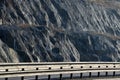 Strengthening the slope with a steel net anchored deep into the rock. falling rocks do not fall on the road. Double barriers are o Royalty Free Stock Photo