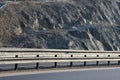 Strengthening the slope with a steel net anchored deep into the rock. falling rocks do not fall on the road. Double barriers are o