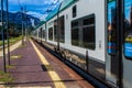 STRESA, ITALY - JULY 14, 2016. Stresa railway station and arriving train Trenord Italia.