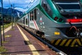 STRESA, ITALY - JULY 14, 2016. Stresa railway station and arriving train Trenord Italia.