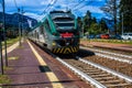 STRESA, ITALY - JULY 14, 2016. Stresa railway station and arriving train Trenord Italia.