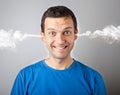 Stress and anger, angry upset man with head pressure and smoke coming out from his head Royalty Free Stock Photo