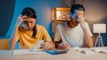 Stress asia couple man and woman use calculator for calculate family budget, debts, expenses during financial economic crisis at