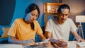 Stress asia couple man and woman use calculator for calculate family budget, debts, expenses during financial economic crisis at