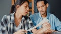 Stress asia couple man and woman use calculator for calculate family budget, debts, monthly expenses during financial economic