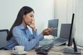 Stress asian woman while coding data programmer on desktop PC while working on computer codes in the office Royalty Free Stock Photo
