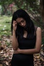 Stress Asian woman in forest