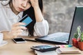 Stress Asian woman looking at credit card in hand no money for debt Royalty Free Stock Photo