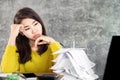 Stress Asian woman looking at  unpaid financial bills and having problem with debt sitting at desk with worried face Royalty Free Stock Photo