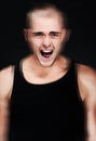 Stress, blur and portrait of screaming man in studio on a black background. Anger, anxiety and face of person