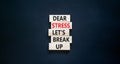 Stress break up symbol. Concept words Dear stress let is break up on wooden blocks. Beautiful black table black background.