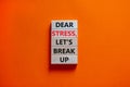 Stress break up symbol. Concept words Dear stress let is break up on wooden blocks. Beautiful orange table orange background.
