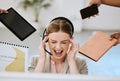 Stress, burnout and overloaded woman at work in a modern office. Female contact centre agent overwhelmed with all the
