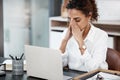 The stress can become a little too much at times. an attractive young businesswoman looking stressed while working at Royalty Free Stock Photo