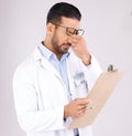 Stress, checklist and man doctor in a studio for a medical diagnosis or wellness treatment. Burnout, headache and male Royalty Free Stock Photo