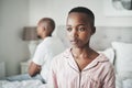 Stress, depression and insomnia, black couple on bed in home angry after argument or fight. Mental health, relationship Royalty Free Stock Photo