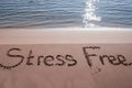 Stress Free Written On Sand Near The Sea At Beach Royalty Free Stock Photo