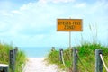 STRESS-FREE ZONE sign at beautiful beach path to ocean Royalty Free Stock Photo