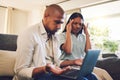 Stress, frustrated and couple on a laptop in the living room of their modern home paying their bills. Upset, technology Royalty Free Stock Photo