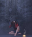 Stress girl sitting alone in a dark room