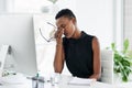Stress, headache and black woman on computer in office with anxiety, pain and audit crisis. Burnout, vertigo and African Royalty Free Stock Photo